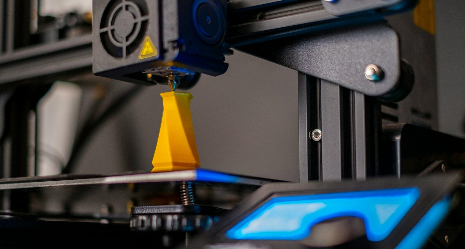 a close up of a machine with a blue light on it